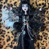 Elvira "Mistress of the Dark" is a captivating and controversial Skullector doll from Monster High